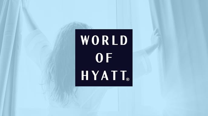 Woman wearing a white robe and opening window curtains to let the sun in with a blue overlay and the World of Hyatt logo in the center