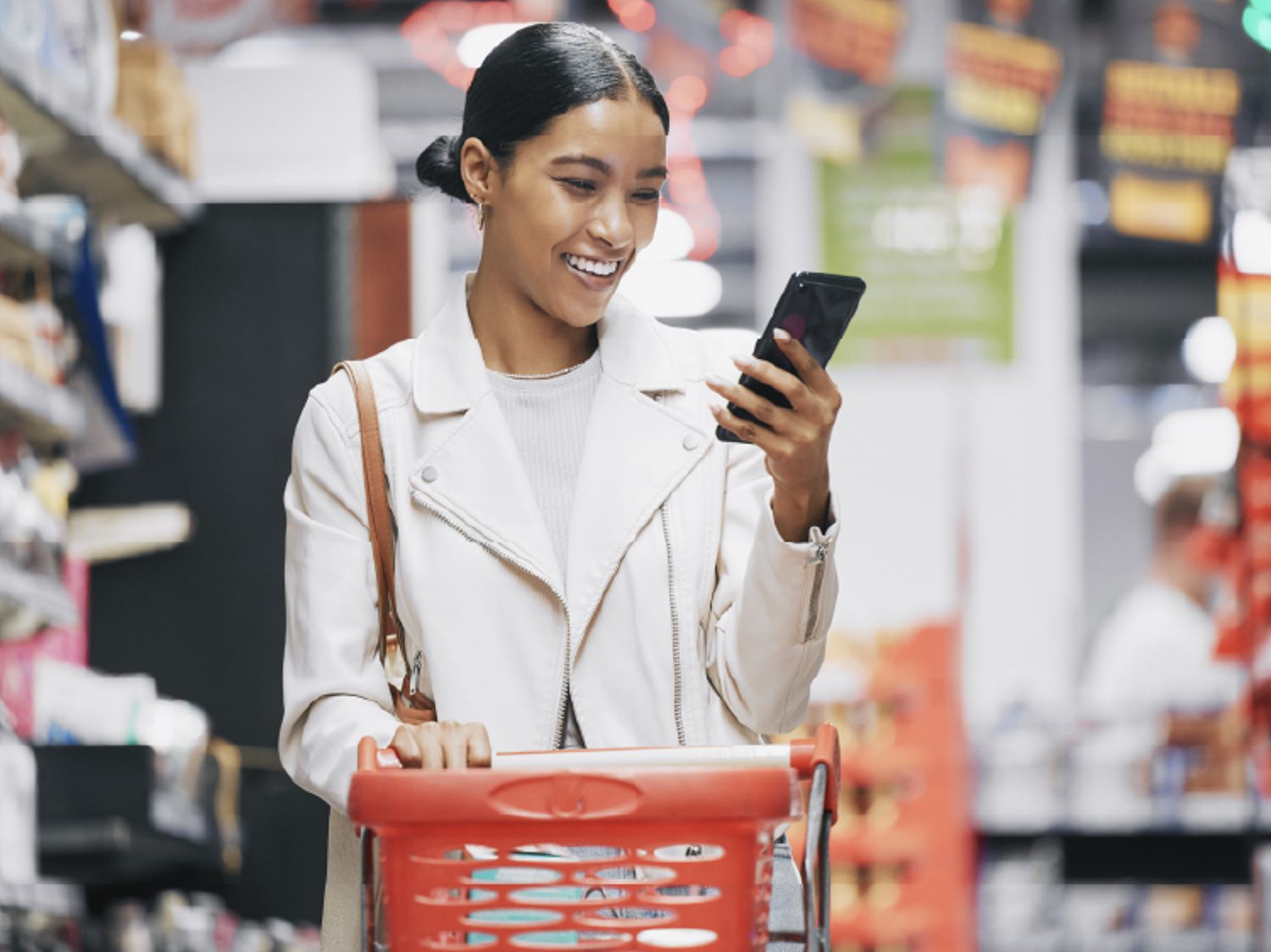Woman on her phone while shopping