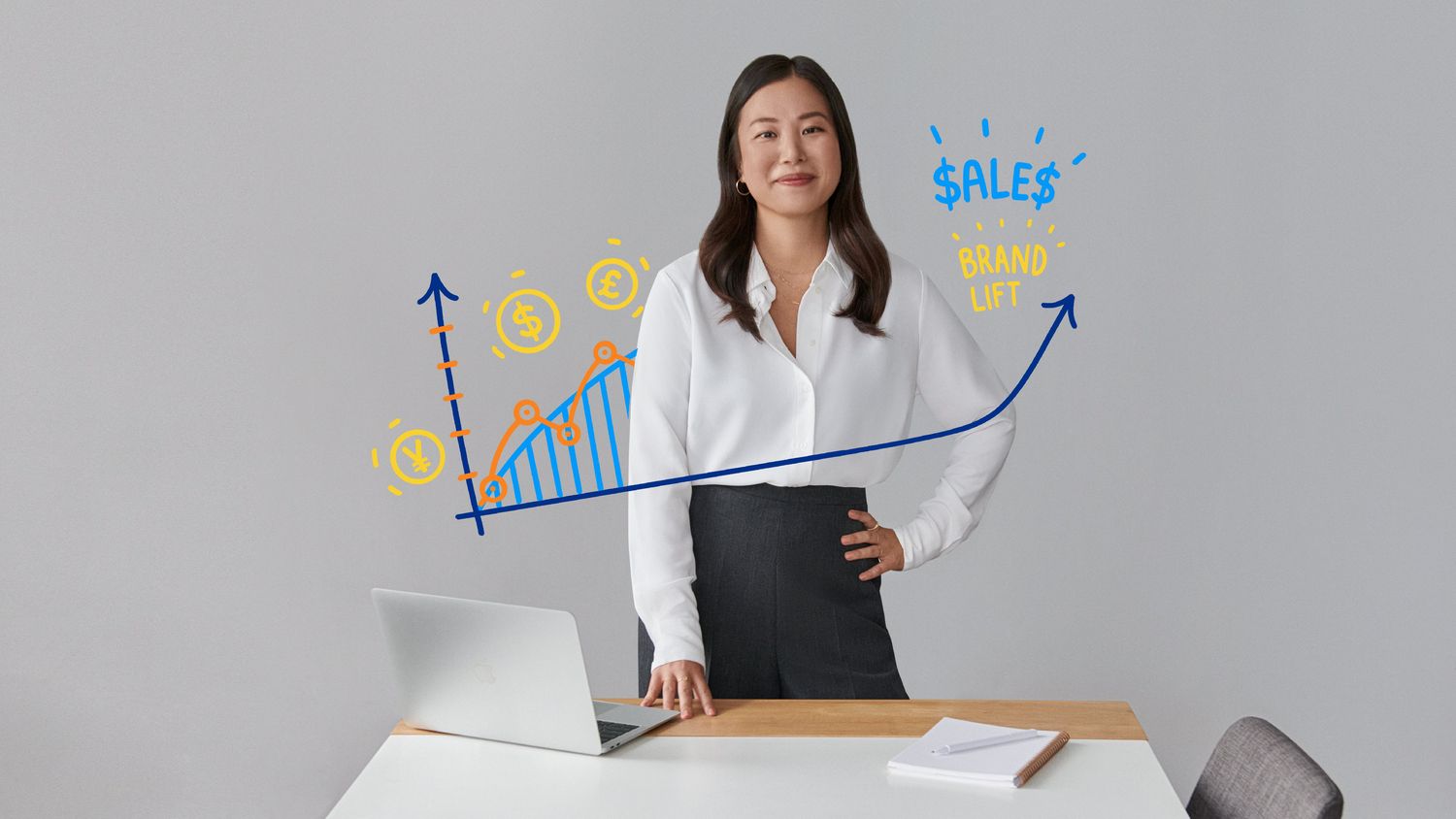 A confident businesswoman stands by her laptop with rising sales graph doodles.