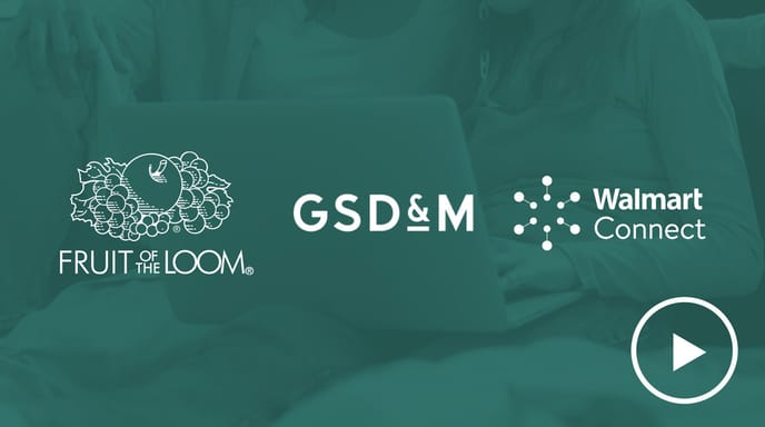 A woman and a young girl sit together using a laptop, overlaid with a green tint and the logos of Fruit of the Loom, GSD&M, and Walmart Connect, along with a play button icon.