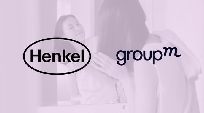 Logo of Henkel and GroupM displayed side by side against a purple background and image of a person brushing their hair.