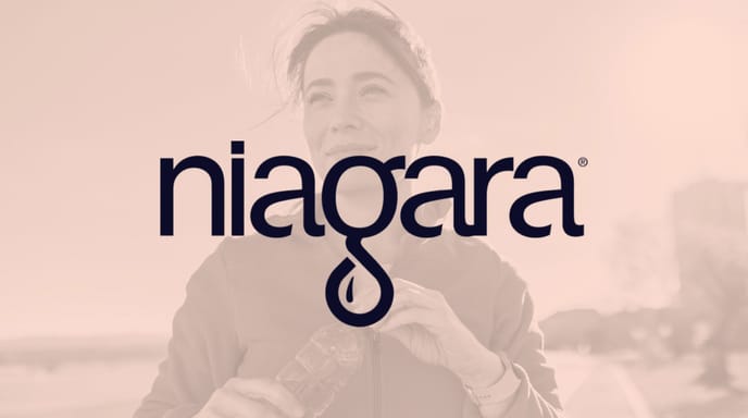 Image of a woman outside closing her water bottle and smiling with an orange overlay and Niagara logo in the middle