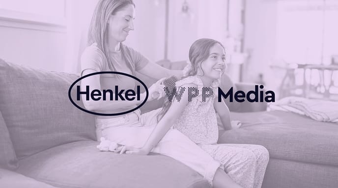 Purple graphic of a woman braiding a child's hair with Henkel and WPP Media logos in the center