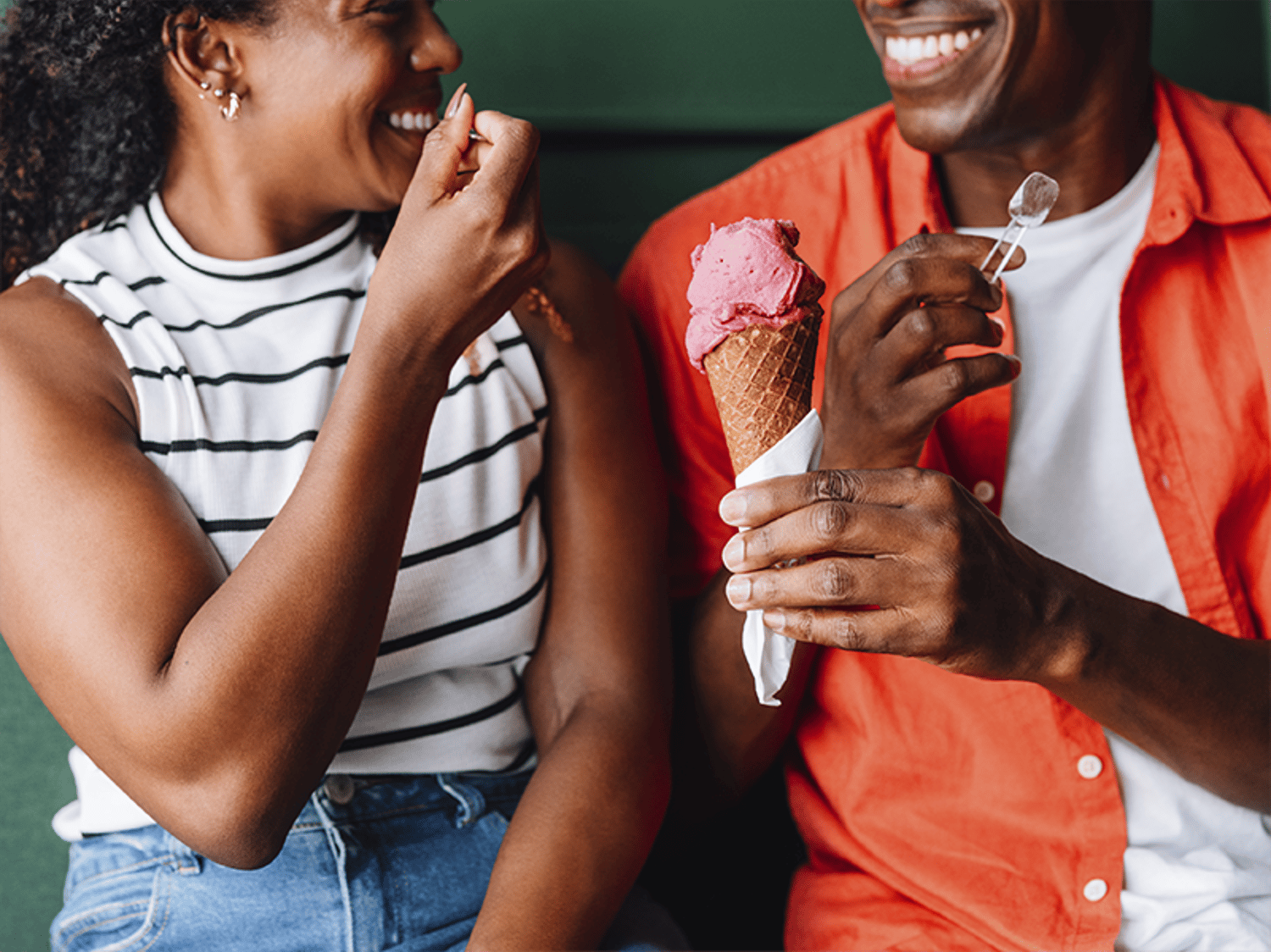 Two people smiling and eating Halotop icecream