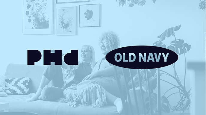 Photo pictures a couple on a couch watching TV and laughing with a blue filter and PHD and Old Navy logos over