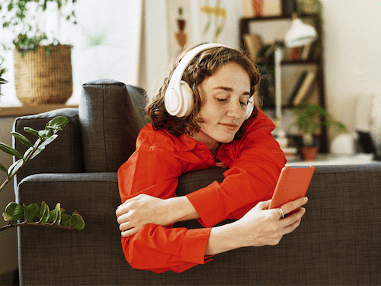 Relaxed home setting with headphones, showcasing comfort and immersive audio experience