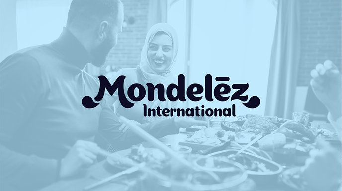 A blue-tinted image of a smiling couple sharing a meal is overlaid with the Mondelēz International logo, highlighting themes of joy and togetherness.