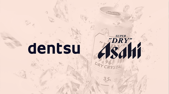 Asahi "Dry Crystal" beer breaking through ice for a campaign with an orange overlay and the "dentsu" and "Asahi" logos over top